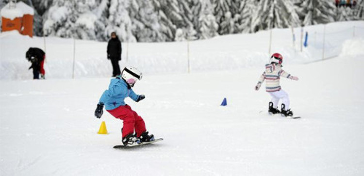 Kid's snowboarding Les Gets Morzine