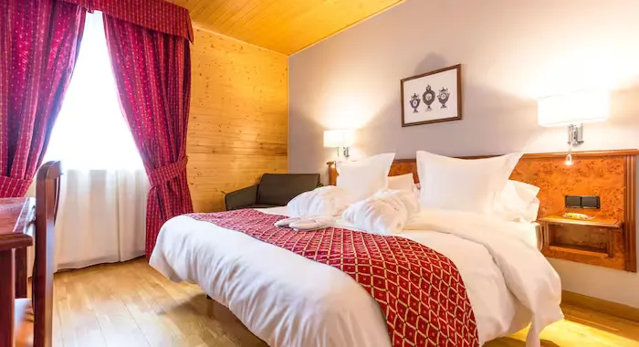 Ski Holidays El Tarter. A double bedroom at Hotel Llop Gris, El Tarter, Andorra