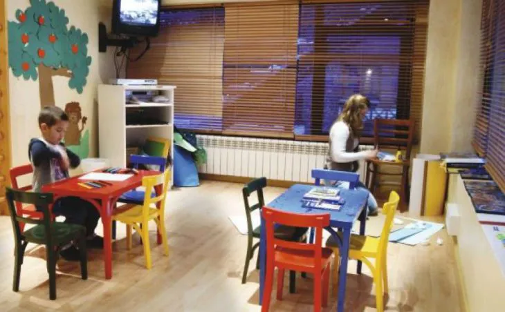 Ski holidays in Arinsal. Kids play at colourful tables in the children's room at Hotel Patagonia