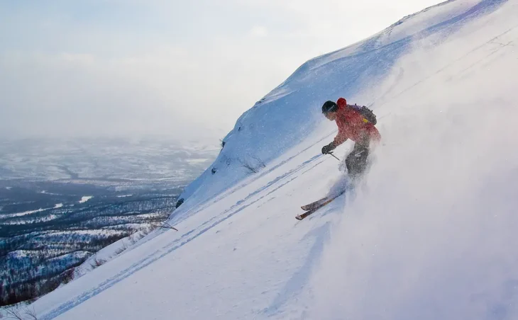A skier enjoying the quiet poles of Sweden on ski holiday.