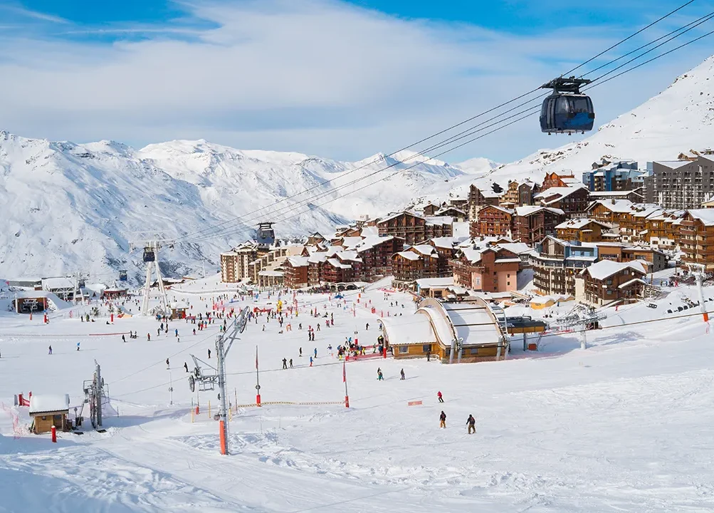 Val Thorens Ski Holidays. Lots of skiers at the foot of the mountain in Val Thorens where the slopes and the resort join.