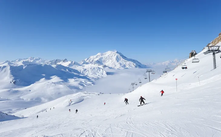 Skiers and snowboarders on the slopes of Val d'Isère