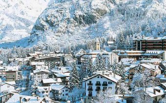 The ski resort of Courmayeur in Italy, sowing the snowy rooftops of the chalets from afar.